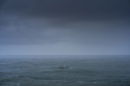 Fishermen in heavy rain.