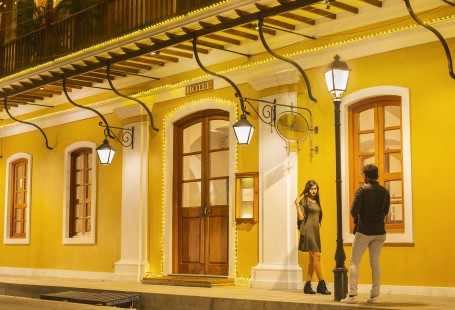 A shooting couple in yellow light